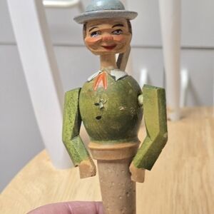 Vintage Wooden Figurine with Green and Silver Accents